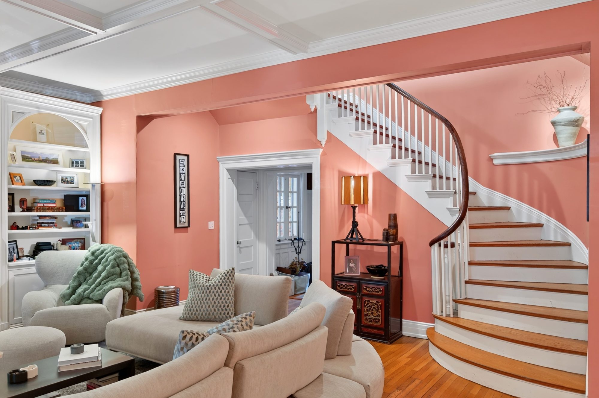 Living room with curved staircase, A Modern Take on the Fan, Richmond, Virginia
