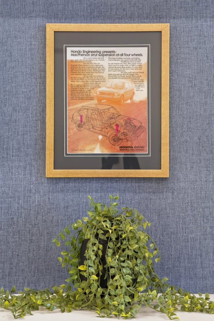 Framed artwork and planting on the blue wall, Honda dealership showroom, Short Pump, Virginia