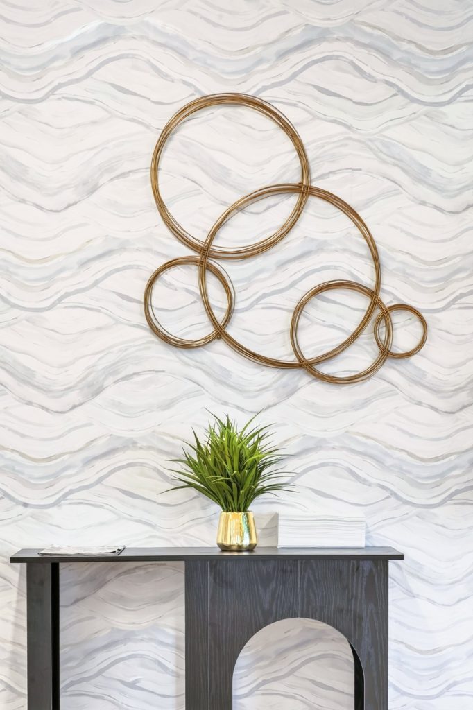 Gold wall sculpture above a console table, Honda dealership showroom, Short Pump, Virginia
