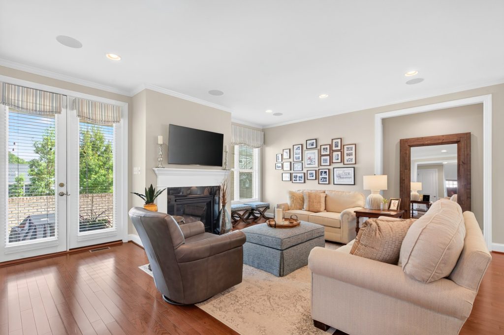Living room with French doors, valance treatment and a gallery wall
