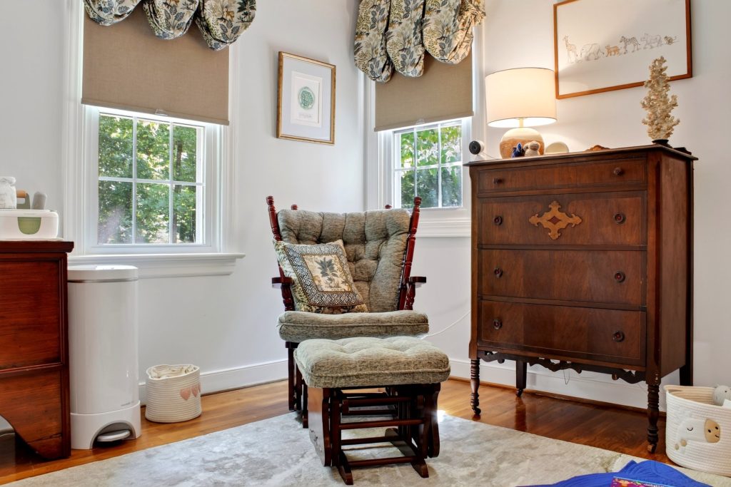 Sitting corner with a rocking chair and a tall antique chest